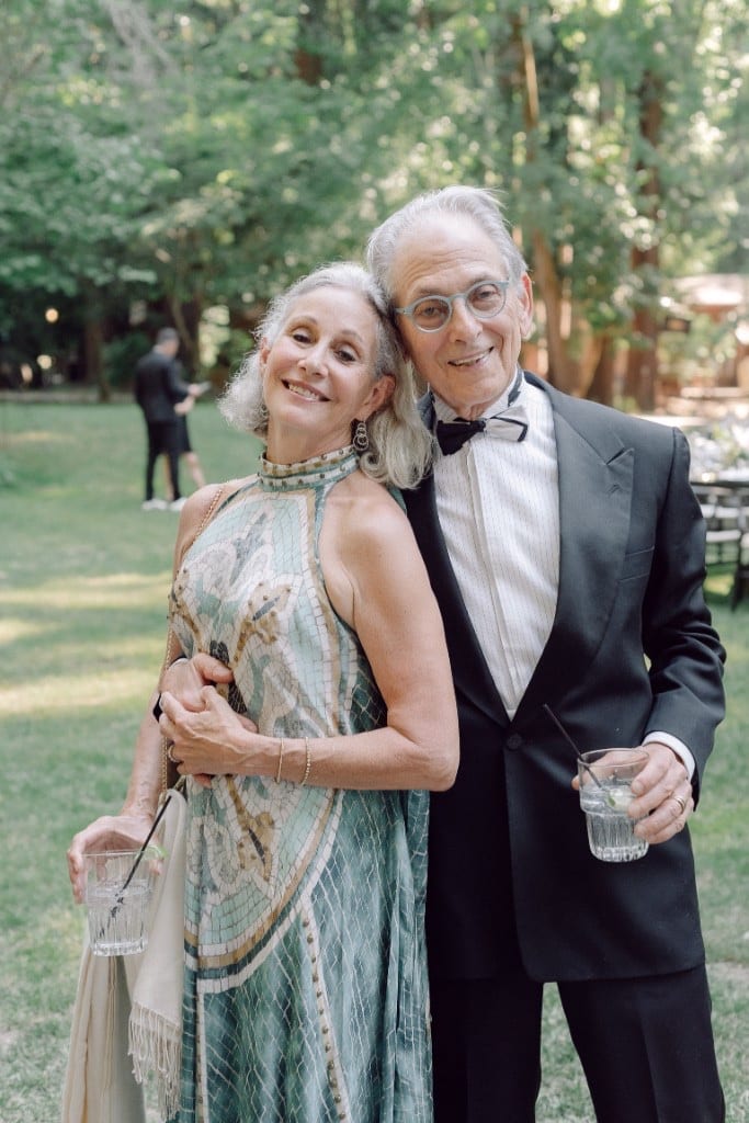 Older couple dressed up with drinks at an event