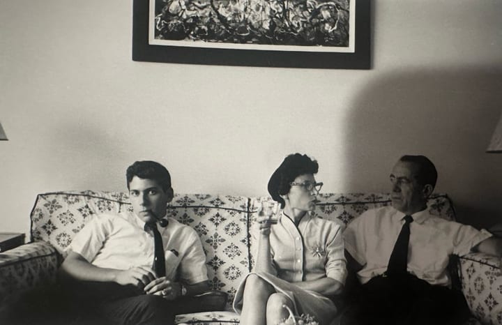 Family on a sofa, mid-century living room